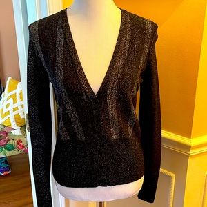 Long sleeve v-neck sweater, button down front. Shimmery design size medium.